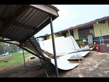 This photo shows a section of the zinc roof of Pratville Primary and Infant School in Manchester that got damaged after being hit by heavy winds caused by the passage of Hurricane Beryl. 