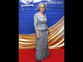 Inductee Cathrine Sani embodies grace dressed in all grey.