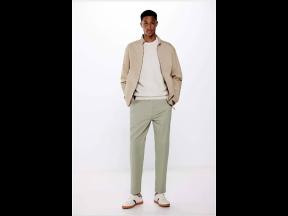 SAINT’s Romaine Dixon rocking lightweight slim-fit chinos, a bomber jacket and retro sneakers from European fashion retailer Springfield’s new menswear collection.