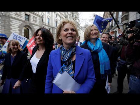 British politicians Anna Soubry (centre), Heidi Allen (second left) and Sarah Wollaston (right) arrive for a press conference in Westminster in London, Wednesday, Feb 20, 2019. Cracks in Britain’s political party system yawned wider Wednesday, as three pro-European lawmakers – Soubry, Allen and Wollaston – quit the governing Conservatives to join a newly formed centrist group of independents who are opposed to the government’s plan for Britain’s departure from the European Union.