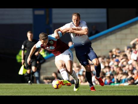 AP
Tottenham Hotspur’s Harry Kane (right) and Burnley’s James Tarkowski battle for the ball during their English Premier League match at Turf Moor in  Burnley, England, yesterday. Burnley won 2-1.