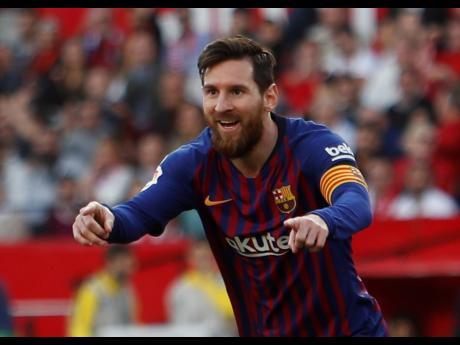 
Barcelona forward Lionel Messi celebrates after scoring his side’s second goal during the  La Liga  match against Sevilla yesterday.