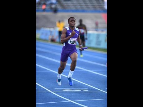
Adrian Kerr anchors Kingston College to victory in the Class Two Boys 4x100 metres at yesterday’s Gibson McCook Relays at the National Stadium. The winners clocked  41.18 seconds. 