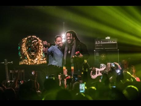 
Mystic performs on  stage with her father, Stephen Marley.