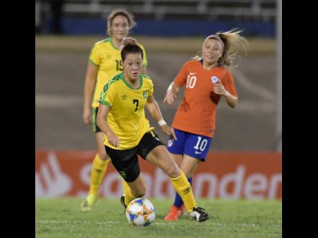 Reggae Girl Chinyelu Asher (centre) is all focus during Jamaica’s 1-0 win over Chile in their friendly international at the National Stadium last Thursday.
