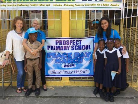 Judy Hepburn (left), Elizabeth Ward (second left), chair of the Violoence Prevention Alliance(VPA) and Cassidy Edwards (right in background),  research associate at the VPA and students from the Prospect Primary school celebrate Peace Day on Tuesday, March 6. The Prospect Primary School was the 2018 winner of the Trees for Peace competition.


