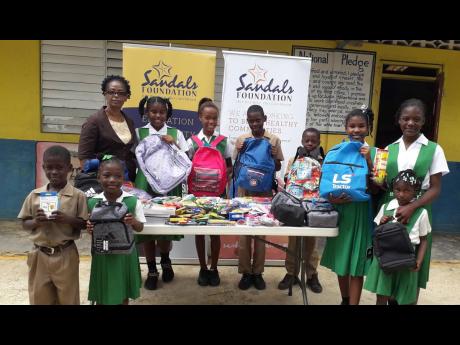 As an ode to it's 10th anniversary this year, the Sandals Foundation recently showed its continued commitment to education by gifting the Garlands Primary School in rural St James, with educational supplies from its Pack For A Purpose Initiative. Here, Principal Georgette Wellington and students show the new gifts which will be used to enhance day-to-day learning at the school.