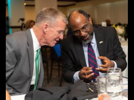 Retired US Army General Stanley McChrystal (left), a senior fellow of Yale University’s Jackson Institute for Global Affairs, in dialogue with Earl Jarrett, CEO of Jamaica National Group, at The Jamaica Pegasus in New Kingston on Thursday. 