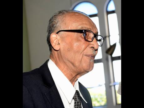 
Pastor Ralston Getfield delivering the remembrance during the funeral for former sports editor of The Gleaner, Tony Becca, at  St Matthew’s Anglican Church in Allman Town, Kingston, yesterday.