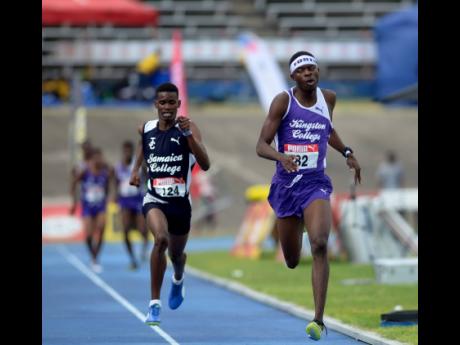 Tarees Rhoden of Kingston College (right) holds on to finish just ahead of Jamaica College athlete J’Voughnn Blake in the Boys Class One 1500m at the Youngster Goldsmith meet held at the National Stadium on February 2, 2018.