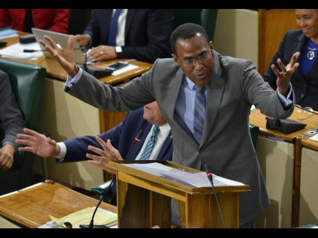 Dr Nigel Clarke, minister of finance and the public service, is animated as he says the economy “is bubbling up” during his contribution to the 2019-20 Budget Debate in Parliament on March 20.