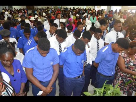 Members of the Jamaica College track and field team attend a church service at the Faith Cathedral Deliverance Centre in St Andrew yesterday. The team was seeking blessing from God in attempt to win their first ISSA/GraceKennedy Boys’ Athletics Championships trophy since 2011. 
