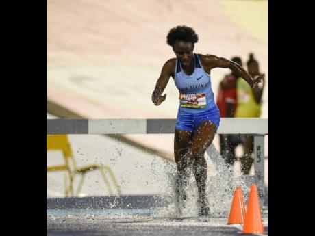 Aneisha Ingram of Edwin Allen winning the girls’ 2000m Steeplechase open final at the ISSA/GraceKennedy Boys’ and Girls’ Athletics Championships at the National Stadium on Thursday. Ingram won with a time of 7:11.17. 