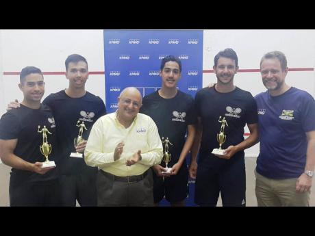 Tarun Handa (third left), managing partner for KPMG in Jamaica, applauds as members of the Adams Family (from left) Robert Roper, Adam Hugh, Adam Lee and Allan Roper display their trophies after winning the 2019 KPMG Squash League, which wrapped up at the Liguanea Club at the weekend. The first-time entrants beat the Power Bolts 3-0 to win the title. Also on hand to congratulate the new champions is Chris Hind, president of the Jamaica Squash Association. 