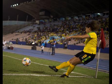 Jamaica’s Marlo Sweatman scores from a corner kick, giving the Reggae Girlz an early lead in their international friendly match against Chile at the National Stadium on Thursday, February 28. 