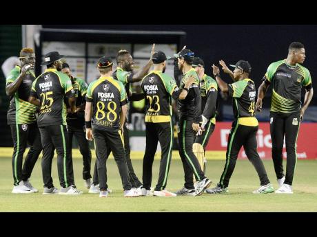 Jamaica Tallawahs players celebrate the fall of a St Lucia Stars wicket in Match 7 of the Hero Caribbean Premier League at Sabina Park on Tuesday, August 14, 2018.