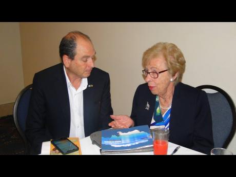 Holocaust survivor Eva Schloss chatting with Israeli ambassador to Jamaica, Danny Barin, at The Jamaica Pagasus on Tuesday, April 2.