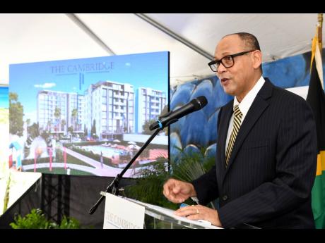 
Eric Hosin, president of Guardian Life Limited, speaks at the launch of housing project The Cambridge on March 21, 2019.