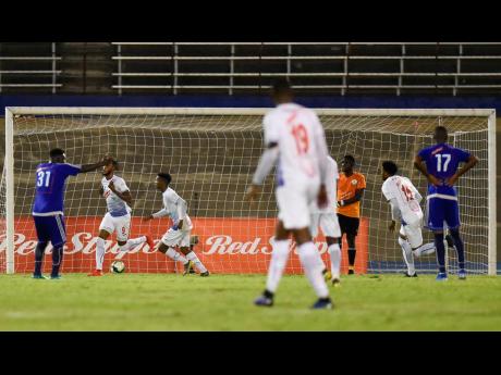 Roshane Sharpe of Portmore United (second from left) celebrates his goal scored minutes before the final whistle, securing Portmore United’s win in the Red Stripe Premier League first-leg semi-final game against Mount Pleasant FA at the National Stadium last Monday. 