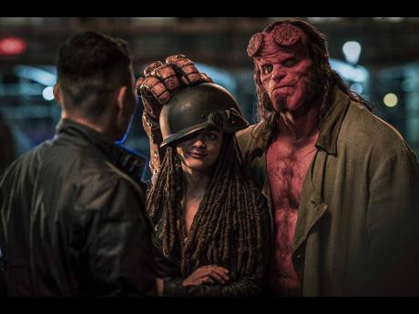David Harbour and Sasha Lane in a scene from ’Hellboy’.