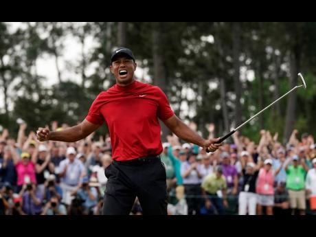 Tiger Woods is overcome with emotion after winning the Masters golf tournament in Augusta, Georgia, yesterday. 