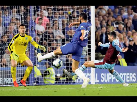 Chelsea’s Ruben Loftus-Cheek (centre) fails to score during their English Premier League match against Burnley at Stamford Bridge in London, England, yesterday. 