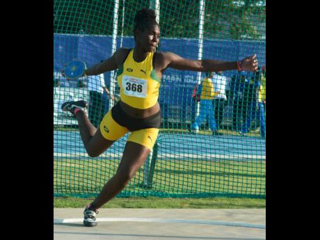 Jamaica’s Cedricka Williams breaks the Under-17 girls discus throw record with a heave of 47.94m on the third and final day at the Carifta Games in the Cayman Islands yesterday. Collin Reid photo courtesy of Courts Jamaica, Guardian Life, Supreme Ventures and Alliance Investments.