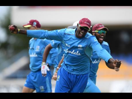 Windies captain Jason Holder celebrates during a net session at the Sir Vivian Richards Stadium in Antigua on Tuesday, January 29, 2019. 