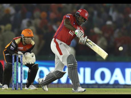 Chris Gayle of Kings XI Punjab plays a shot during the VIVO IPL T20 cricket match against the Sunrisers Hyderabad in Mohali, India yesterday. 
