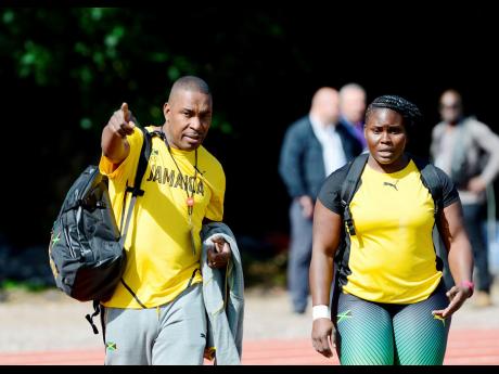 Dr Carl Bruce (left) in discussion with Danniel Thomas-Dodd during a JAAA training camp at the University of Birmingham ahead of the IAAF World Championships in London in 2017.