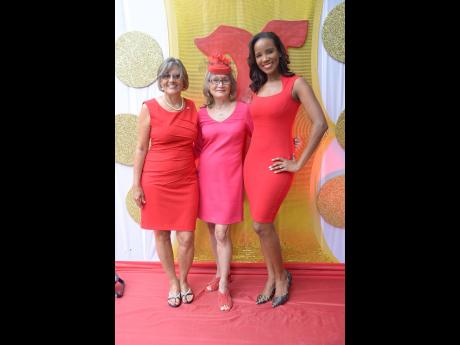 Royally red beauties: Thalia Lyn, chief executive officer of Island Grill, is sandwiched by Debra Chen (left), executive director of Heart Foundation, and the new Go Red brand ambassador for the Heart Foundation, Dr Sarah Lawrence. 