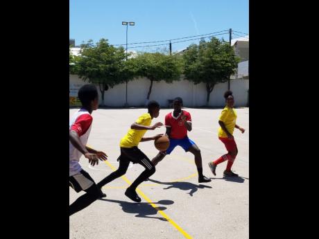 Children taking part in the mixed basketball competition staged by the MultiCare Youth Foundation at the Breezy Castle Centre on Harbour Street in downtown Kingston from Tuesday, May 14, to Wednesday, May 15.