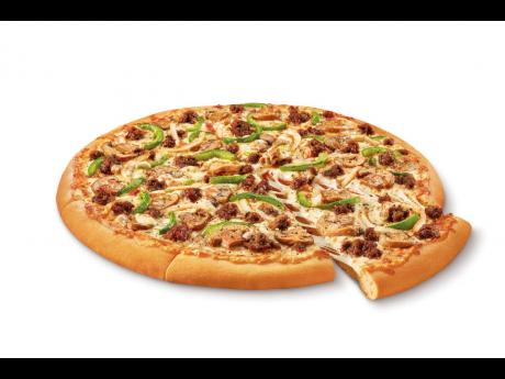 This undated image provided by Little Caesars shows the Impossible Supreme pizza. Plant-based burger maker Impossible Foods is debuting its second product – meatless sausage crumbles – on Little Caesars pizza. 