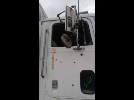 Bullet holes and bloodstains on the driver’s side of the delivery truck bear testament to the daring attack on the unit as the three men wrapped up operations on Tuesday night.