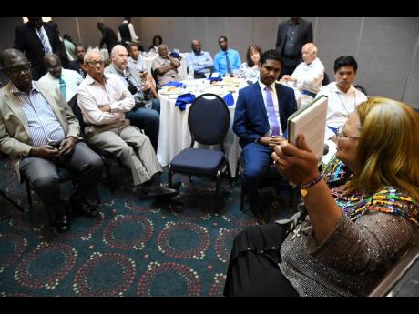 Dr Alveda King (right), niece of the Reverend Dr Martin Luther King Jr and international advocate for human rights of the child, delivers a pro-life message to 50 church leaders at a breakfast meeting at The Jamaica Pegasus hotel in New Kingston yesterday. 
