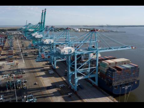 A container ship is unloaded at the Virginia International Gateway terminal in Norfolk, Virginia.