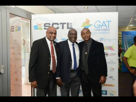 We’re buddies! (From left) Pals Dr Fritz Pinnock, Ruel Reid, and Balfour Peart pose for a snap. Contributed