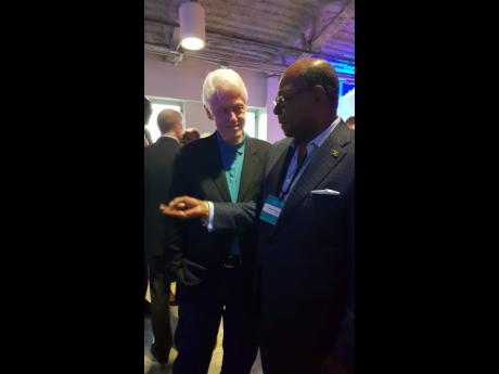 Tourism Minister Edmund Bartlett engages former US President Bill Clinton in discussion on the Global Tourism Resilience and Crisis Management Centre in the US Virgin Islands. Clinton showed great interest in supporting the centre and its objectives of building resilience in the region.