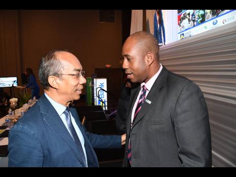 National Security Minister Dr Horace Chang (left) makes a point to Ryan Parkes, chief of business banking and public sector engagement at JN Bank. They were attending the Jamaica Police Federation’s 76th Annual Conference, which concluded last Thursday at the Moon Palace Jamaica Grande in Ocho Rios, St Ann. 