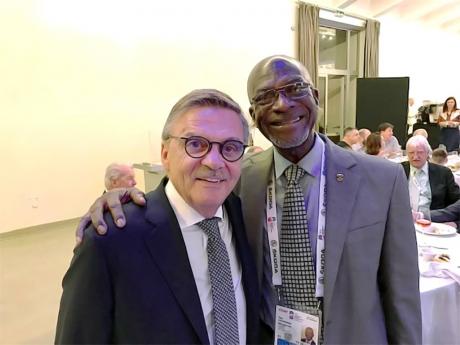 Jamaica Olympic Ice Hockey Federation director Don Anderson (right) with International Ice Hockey Federation president Rene Fasel at the global body’s annual congress in Slovakia recently.