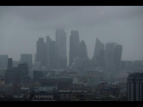 The skyline is seen through the rain and mist in London, Monday June 10, 2019.  
