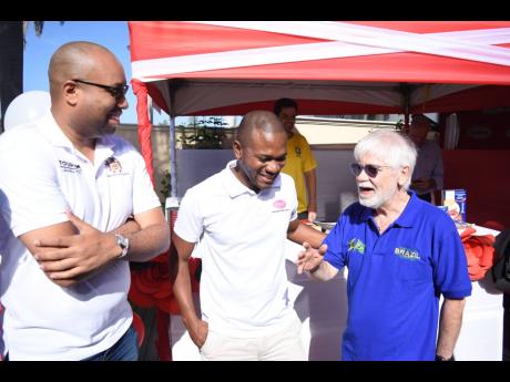 Brazilian Ambassador to Jamaica, His Excellency Carlos Alberto M. den Hartog (right) welcomes Delano Seiveright (left), Strategist and Senior Advisor in the Ministry of Tourism, and Omar Palmer, LASCO Distributors Limited Consumer Division Marketing Manager, to the ‘Bramaican Breakfast’ kick-off event, recently.



