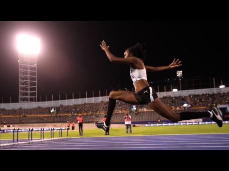 Shanieka Ricketts speeds down the runway to set a meet record of 14.69m in the women’s triple jump event at the Racers Adidas Grand Prix at the National Stadium last Saturday. 
