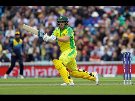 Australia captain Aaron Finch plays a shot off the bowling of Sri Lanka’s Nuwan Pradeep during their ICC World Cup cricket match at The Oval in London, England, yesterday. 