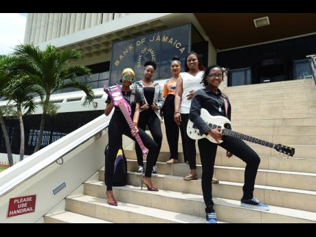 Members of the all-female band ADAHZEH. From left: Chevanese Palmer, Karissa Palmer, Gabeana Campbell, Tashana Barnett and Shadeeka Daughma, on the steps of the Bank of Jamaica in Kingston. 
