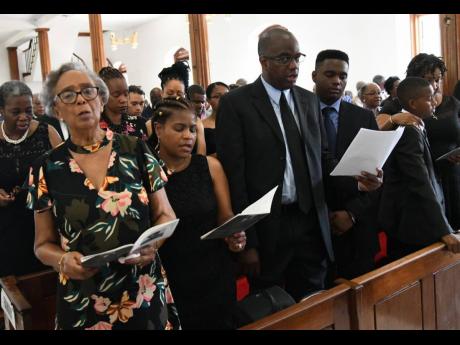 From left: Barbara Bailey, widow of the Reverend Cyril Evans Bailey, and other family members – Carolyn Bailey, Michael Bailey, Daryl Bailey, Stephen Bailey and Kerry-Ann Bailey – at the funeral for the former RJR chairman at the University Chapel yesterday.