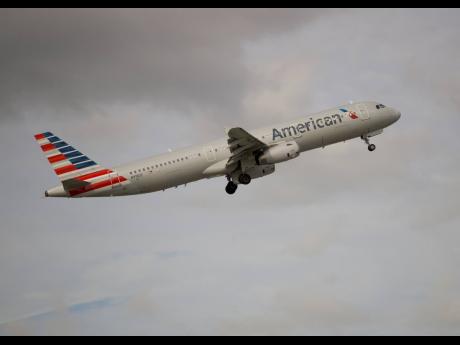 In this Thursday, November 29, 2018 photo, an American Airlines Airbus A321 takes off from Fort Lauderdale–Hollywood International Airport in Fort Lauderdale, Florida.