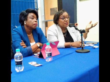 Retired Deputy and Acting Commisisoner of Police, Novelette Grant (Left) and chief executive officer of the Child Protection and Family Services Agency, Rosalee Gage-Grey (Right) participating in the Female Development World Organization’s 2nd Biennial Protect  The Children Symposium at the University of Technology in St Andrew, on June 20, 2019. 
