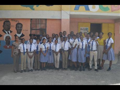 Members of the grade six cohort at Hosanna Preparatory School in Montego Bay, St James, with teachers Shammy Green-Dawkins (second right) and Chantelle Duhaney (left).