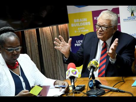 Karl Samuda, the minister overseeing the Ministry of Education, Youth and Information, and Permanent Secretary Dr Grace McLean speak to the media yesterday ahead of the release of the results for the inaugural sitting of the Primary Exit Profile tests this year. The press conference was held at the ministry’s National Heroes Circle office in Kingston.